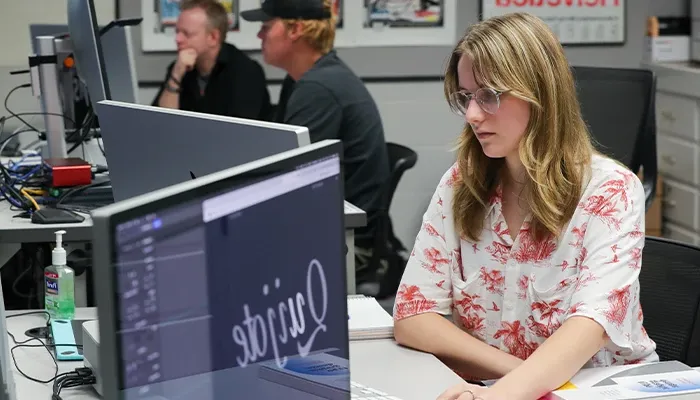 a student works at a computer in class